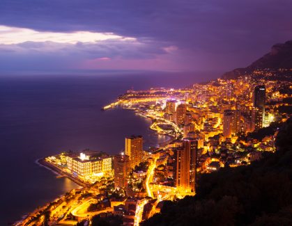 High angle view of Monte Carlo city lights at night, Monaco
